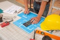 Close-up Of Person`s engineer Hand Drawing Plan On Blue Print with architect equipment. Royalty Free Stock Photo