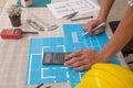 Close-up Of Person`s engineer Hand Drawing Plan On Blue Print with architect equipment. Royalty Free Stock Photo