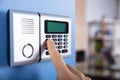 Person`s Finger Entering Code In Security System