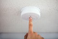 Person Testing Smoke Detector Royalty Free Stock Photo