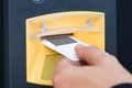 Person`s Hand Inserting Ticket In Parking Slot Royalty Free Stock Photo