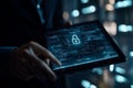 Cybersecurity concept of digital data protection with a glowing padlock icon on a tablet screen displaying binary code Royalty Free Stock Photo
