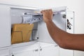 Close-up Of A Person`s Hand Taking Letters From Mailbox Royalty Free Stock Photo