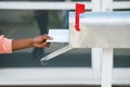 Person Putting Letters In Mailbox Royalty Free Stock Photo