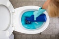 Close-up Of A Person`s Hand Cleaning Toilet Royalty Free Stock Photo