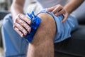 Man Applying Ice Gel Pack On His Knee Royalty Free Stock Photo