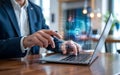 Close-up of a person in a suit using a laptop with a holographic AI interface and data streams, representing advanced artificial Royalty Free Stock Photo