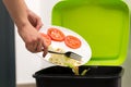 Throwing food in the trash Royalty Free Stock Photo