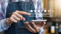Person using smartphone checking five star online reviews and ratings feedback AI generated.