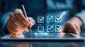 Close-up of a person using a stylus on a digital tablet with glowing checkboxes symbolizing task completion and efficient workflow Royalty Free Stock Photo