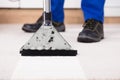 Person Using Vacuum Cleaner For Cleaning Carpet Royalty Free Stock Photo