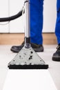 Person Using Vacuum Cleaner For Cleaning Carpet Royalty Free Stock Photo