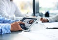 Close up of person video conferencing with colleagues on digital tablet, analyzing financial statistics Royalty Free Stock Photo