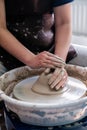 Close up of a person working on a pottery wheel. Royalty Free Stock Photo