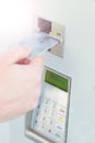 Close-up of person& x27;s hand inserting credit card into machine to pay ticket Royalty Free Stock Photo