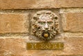 Close-up of a personified stone wall with a name plaque Royalty Free Stock Photo