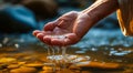Close-up of a persons hand gently scooping fresh river water, symbolizing purity, life, natures gift, and the simplicity of Royalty Free Stock Photo