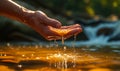 Close-up of a persons hand gently scooping fresh river water, symbolizing purity, life, natures gift, and the simplicity of Royalty Free Stock Photo