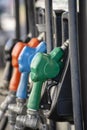 Petrol pump filling nozzles. Fuel at gas station close up Royalty Free Stock Photo