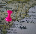 Close up of Philadelphia pin pointed on the world map with a pink pushpin Royalty Free Stock Photo