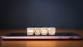 Close-up of a phone, email, chat and post icons wooden dice arranging in a row on mobile phone Royalty Free Stock Photo