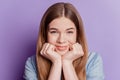 Close up photo of adorable lovely girl hands face on violet background