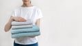 Woman with fresh towel in laundry room interior Royalty Free Stock Photo