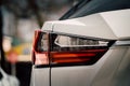 Close up photo of back view luxury car with futuristic tail lights Royalty Free Stock Photo