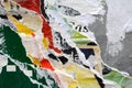 Close up photo of a background image of torn layers of advertising posters