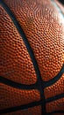 Close-up photo of a basketball that fills the entire frame, showcasing sports photography.