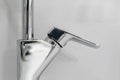 Close up photo of bathroom interior and brand new glittering faucet b Royalty Free Stock Photo