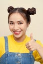 Close up photo beautiful amazing she her lady two buns shocked cool show thumb finger wear jeans dungaree