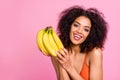 Close up photo beautiful funny she her dark bronze skin body model lady hold hands arms exotic fruit bananas toothy Royalty Free Stock Photo