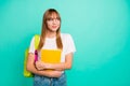 Close up photo beautiful she her lady look side empty space arms hands school colored notebooks modern backpack listen