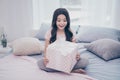 Close up photo beautiful she her little girl sitting bed sunday weekend morning got large giftbox parents unexpected Royalty Free Stock Photo