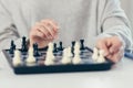 Close-up photo of a woman`s hands making a move in a game of chess Royalty Free Stock Photo