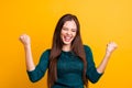 Close up photo beautiful yelling her she lady eyes closed open toothy mouth arms fists raised up air brown eyes ecstatic Royalty Free Stock Photo