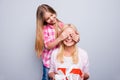 Close up photo blond hair she her granny little granddaughter hide eyes do not look surprise hold large big giftbox wear Royalty Free Stock Photo