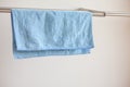 Close-up photo of a blue microfiber cloth for cleaning on the drying rack. Cloth for cleaning. Royalty Free Stock Photo