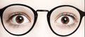 Close up photo of boy eyes wide open in glasses Royalty Free Stock Photo