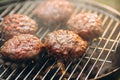 Close-up photo of burger cutlets on grill. Tasty food Royalty Free Stock Photo