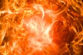 A close-up of an inferno, its vibrant orange flames dancing across the abstract background like heat waves