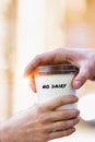 Close up photo of businesswoman giving businessman a cup of coffee with no dairy