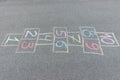 Close-up photo of chalk painted hopscotch on asphalt. School yard. Back to school Royalty Free Stock Photo