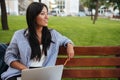 Close-up photo of charming asian woman, sitting with laptop, loo Royalty Free Stock Photo