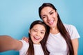 Close up photo cheer beautiful two people brown haired mum mom small little daughter make take selfies mouth laugh Royalty Free Stock Photo