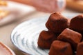 Close up of chocolate truffel candies on plate Royalty Free Stock Photo