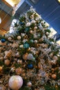 Close up photo of a Christmas tree with decorations, garlands and lights Royalty Free Stock Photo