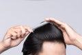 Close up photo of clean healthy man`s hair. Young man comb his h