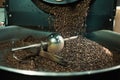 Close up photo of coffee roasting machine in process. Royalty Free Stock Photo